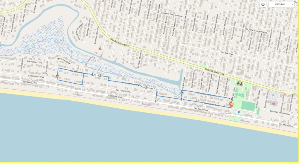 Street map of the golf cart parade route on Oak Island, looping west from Middleton Park along East Dolphin Drive and East Pelican Drive and back.