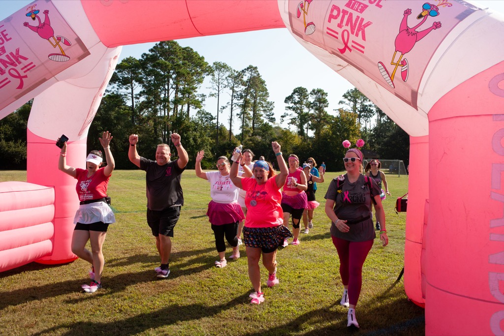 Registrants cheering as they come through the finish arch