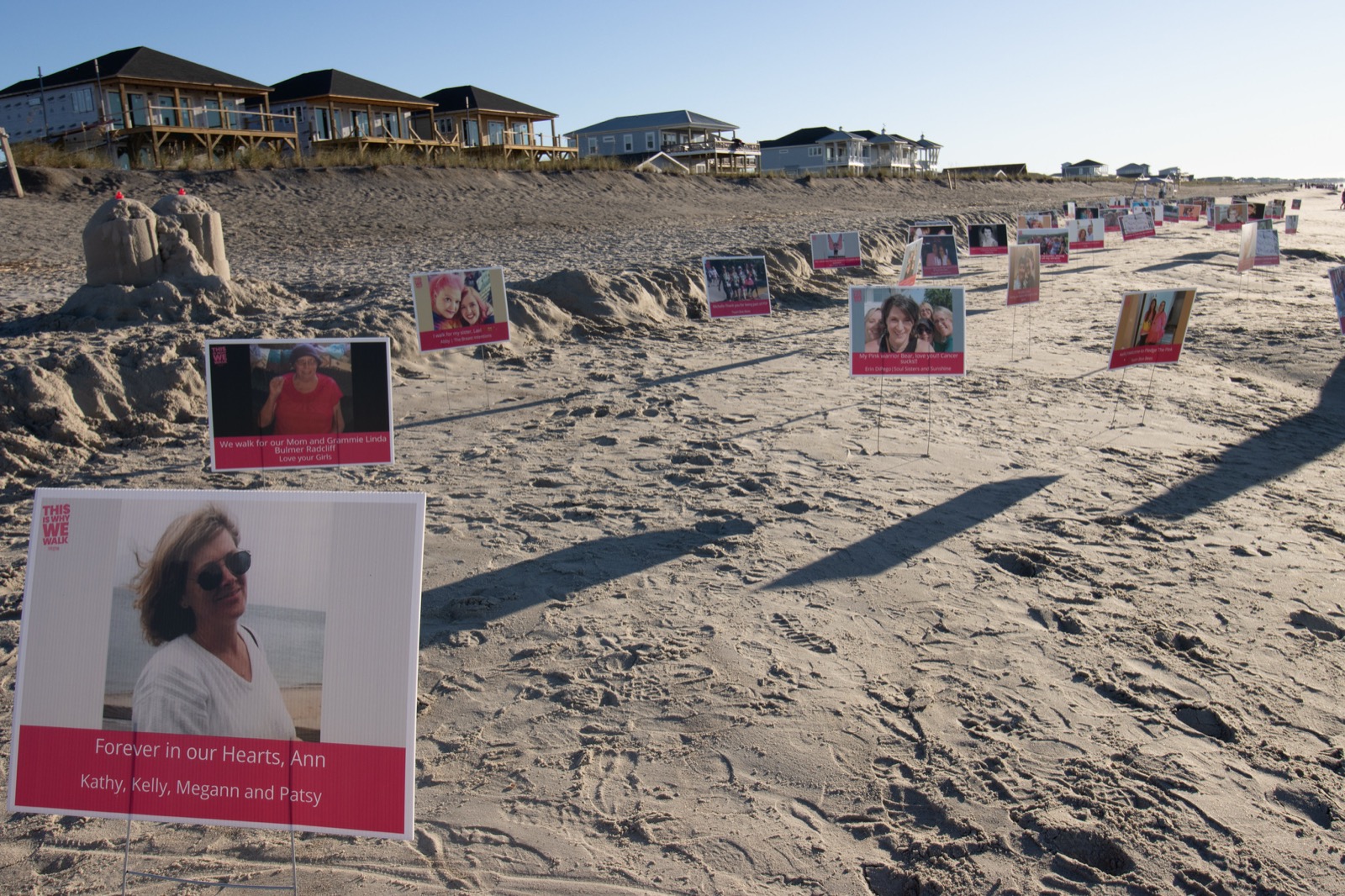 Tribute signs planted in the dunes