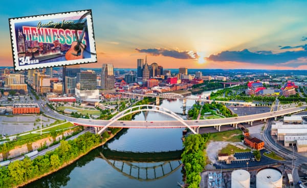 Aerial view of downtown Nashville at sunset, with a "Greetings from Tennessee" postage stamp