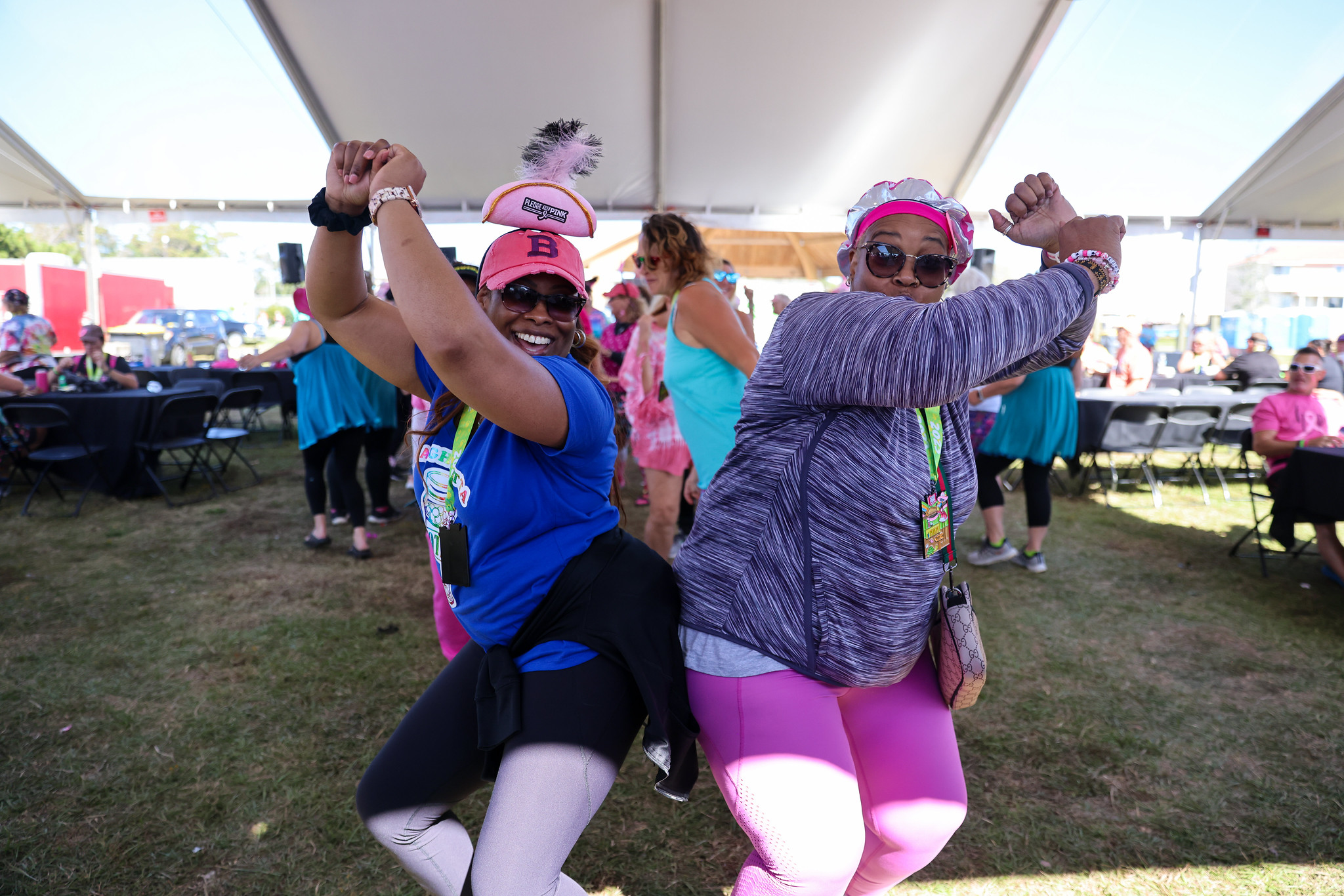 Two FlockStars dancing back to back under the tent