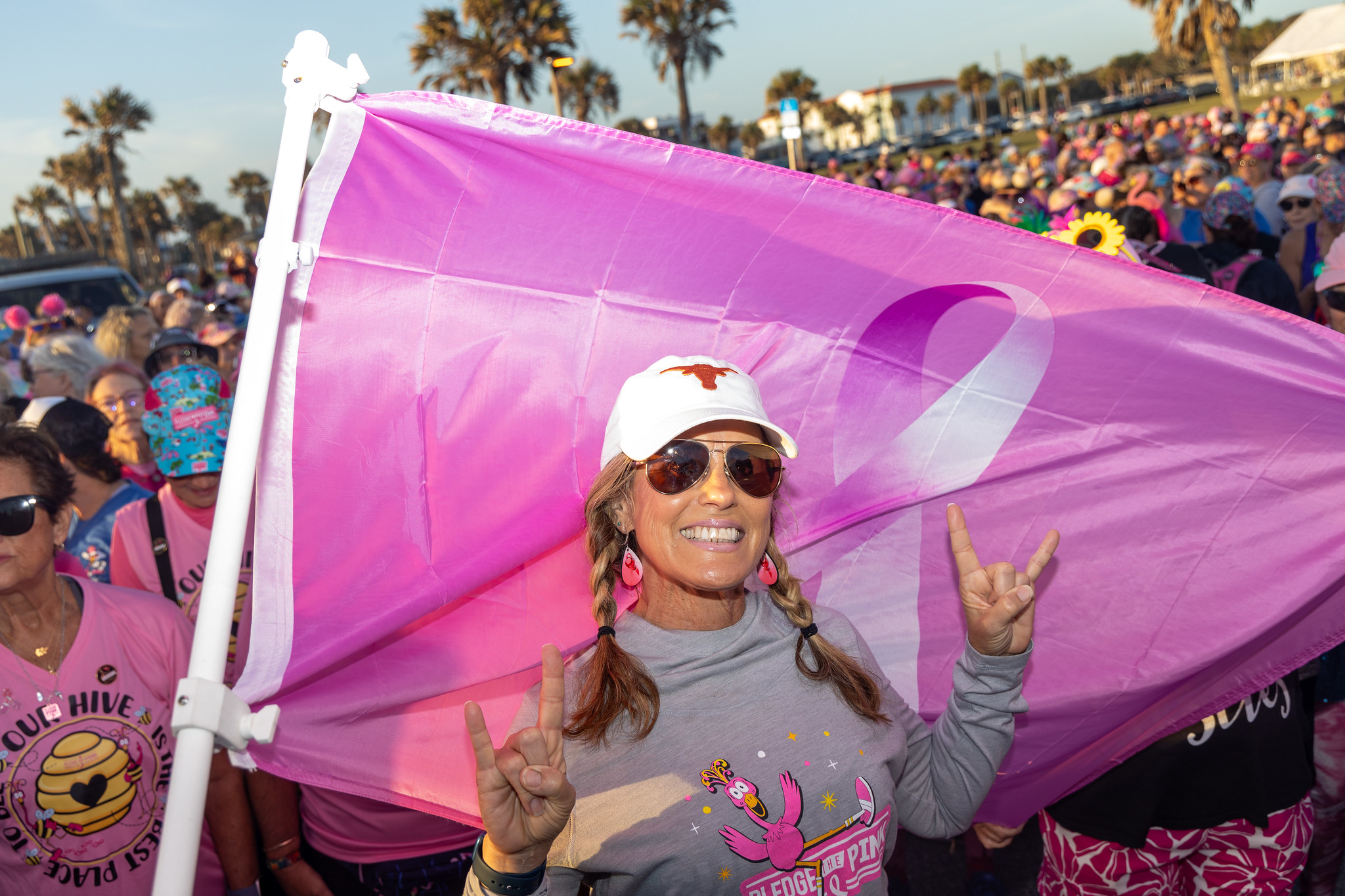 A FlockStar carrying the pink ribbon flag at the start line