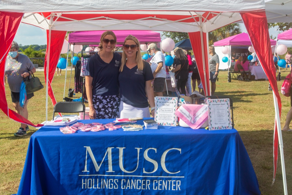 Sponsor team at their tent with giveaways and a scavenger hunt sign