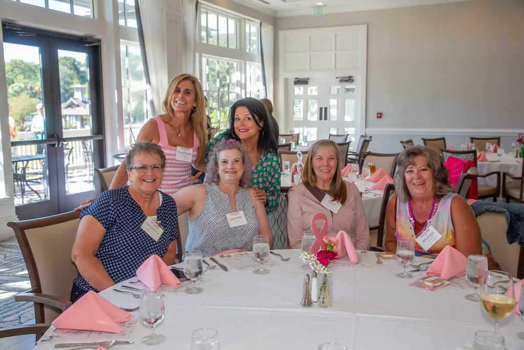 A table of survivors smiling together