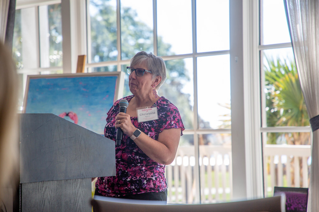 A survivor speaking at the luncheon podium