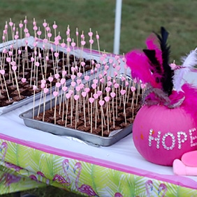 Set up a table with snacks or pink lemonade